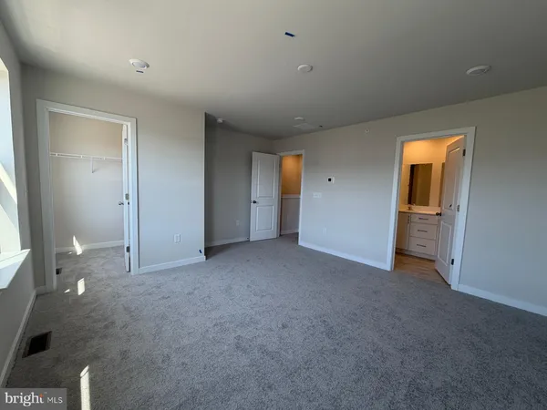 an empty room with closet area