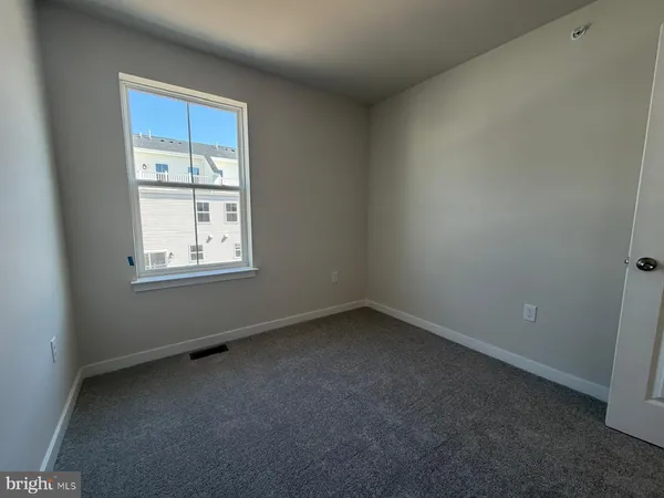 a utility room with a sink and a toilet
