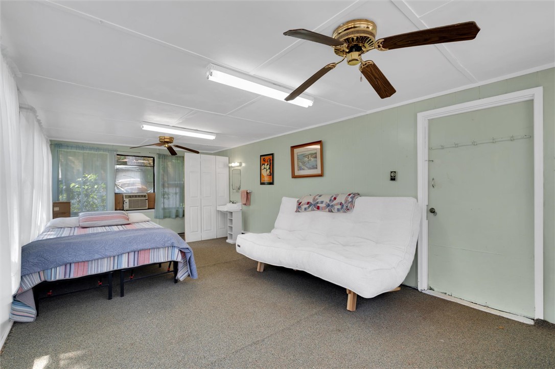1815 Pearman Dairy Road Anderson, SC 29625 - Photo 26 of 35 A spacious room offers comfortable living with carpeted floors and a window unit for climate control.