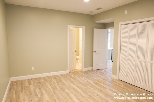 10 Roxbury Street, Unit 8 Boston, MA 02119 - Photo 3 of 8 a view of an empty room and window