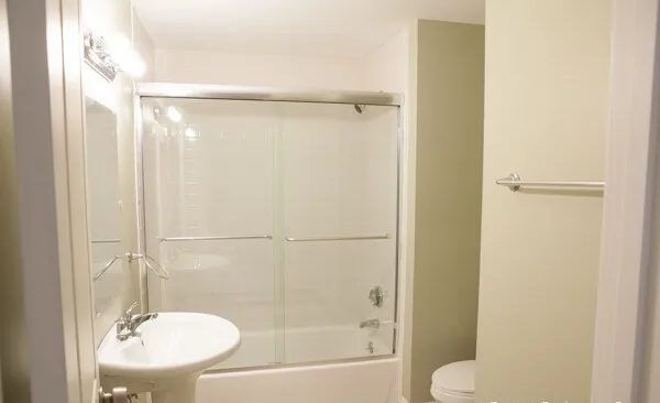 a bathroom with a shower and a toilet