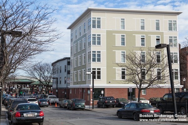 10 Roxbury Street, Unit 8 Boston, MA 02119 - Photo 8 of 8 a view of a cars park in front of a building