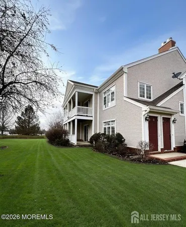 a view of house with yard