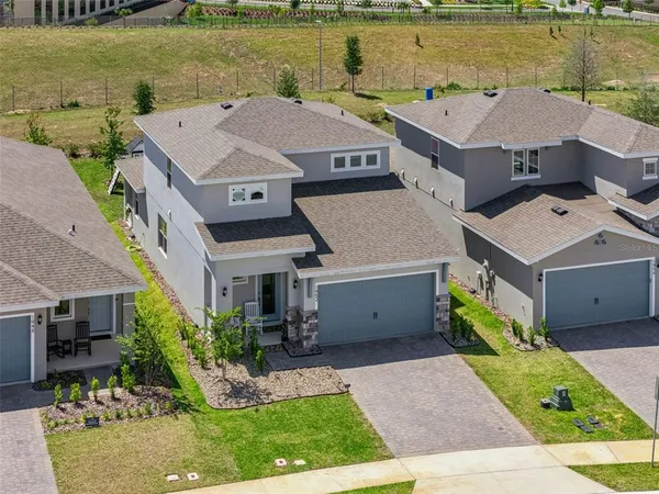 an aerial view of a house with a ocean view