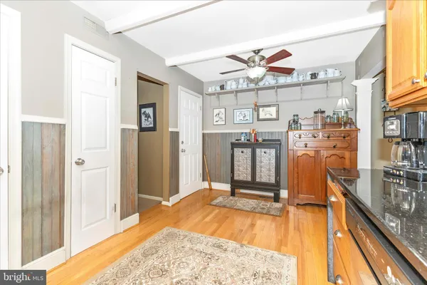 a kitchen with a refrigerator sink and cabinets