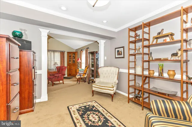 a bedroom with furniture and a book shelf