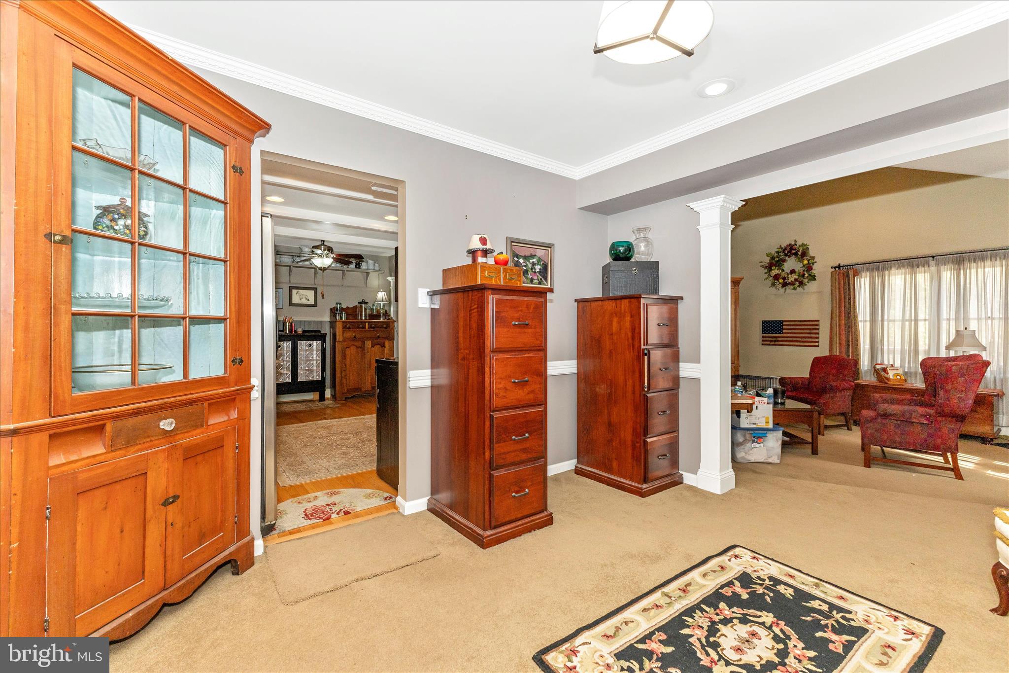 1111 Cummings Avenue Baltimore, MD 21228 - Photo 19 of 48 a view of a livingroom with furniture and a window