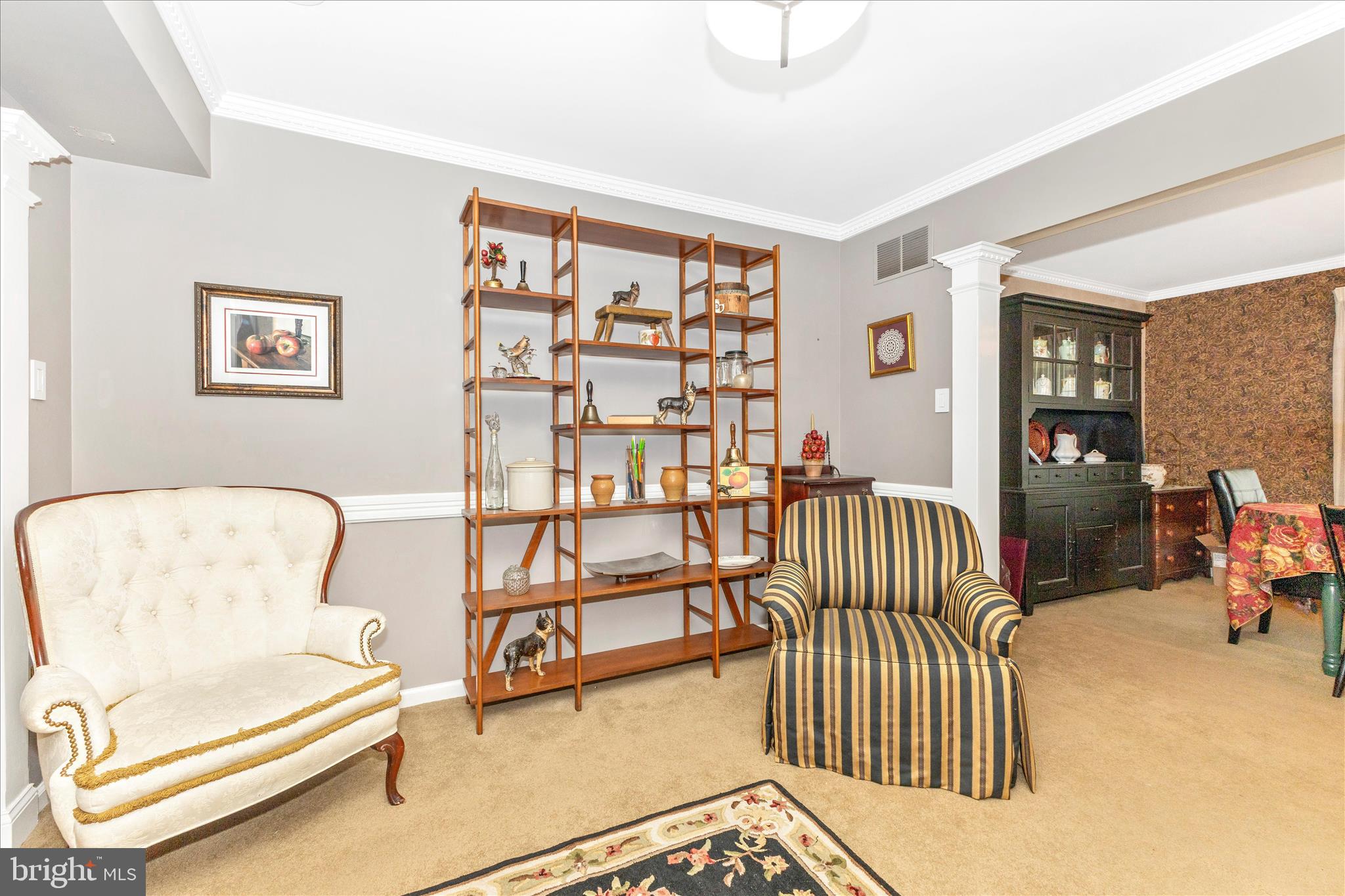 1111 Cummings Avenue Baltimore, MD 21228 - Photo 20 of 48 a bedroom with furniture and a book shelf