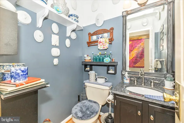 a bedroom with a bed a rug and a window