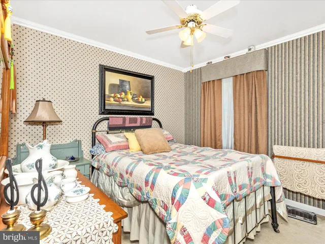 a bedroom with furniture and a window