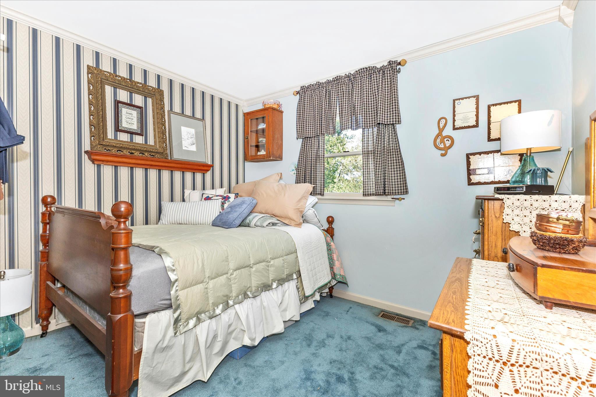 1111 Cummings Avenue Baltimore, MD 21228 - Photo 31 of 48 a bedroom with furniture and a window
