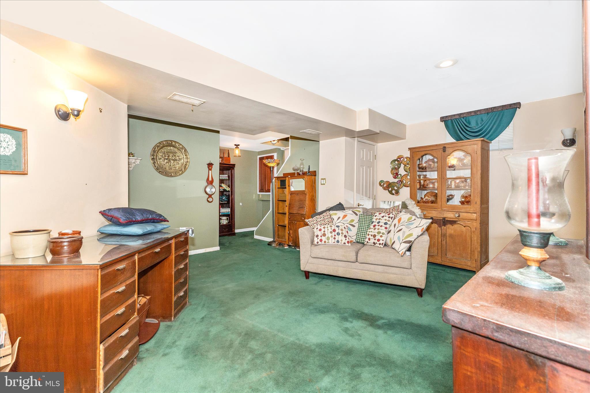 1111 Cummings Avenue Baltimore, MD 21228 - Photo 38 of 48 a living room with furniture and a flat screen tv