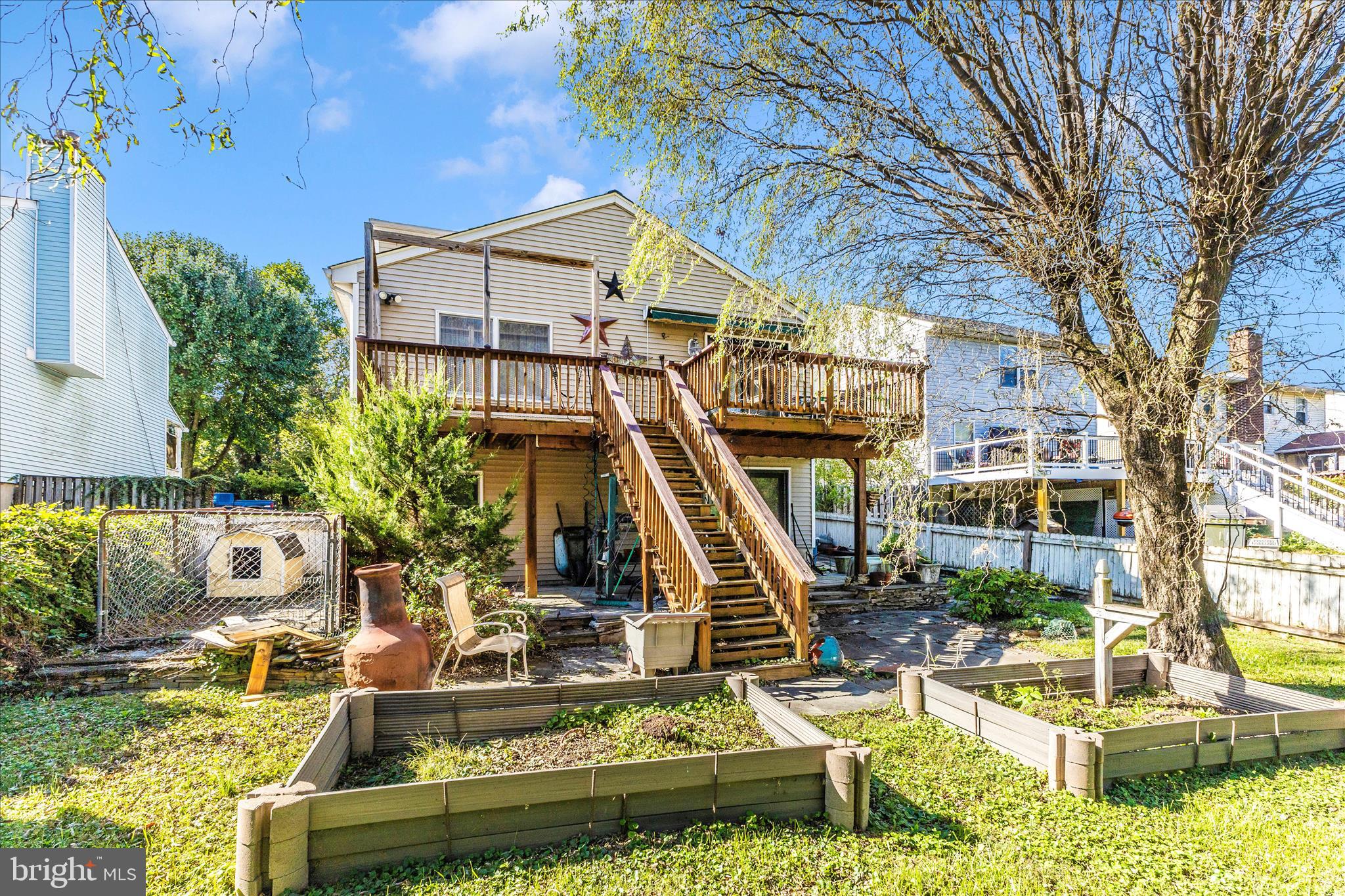 1111 Cummings Avenue Baltimore, MD 21228 - Photo 39 of 48 a view of a house with a small yard and potted plants