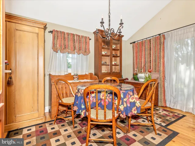 a bedroom with furniture and a lamp