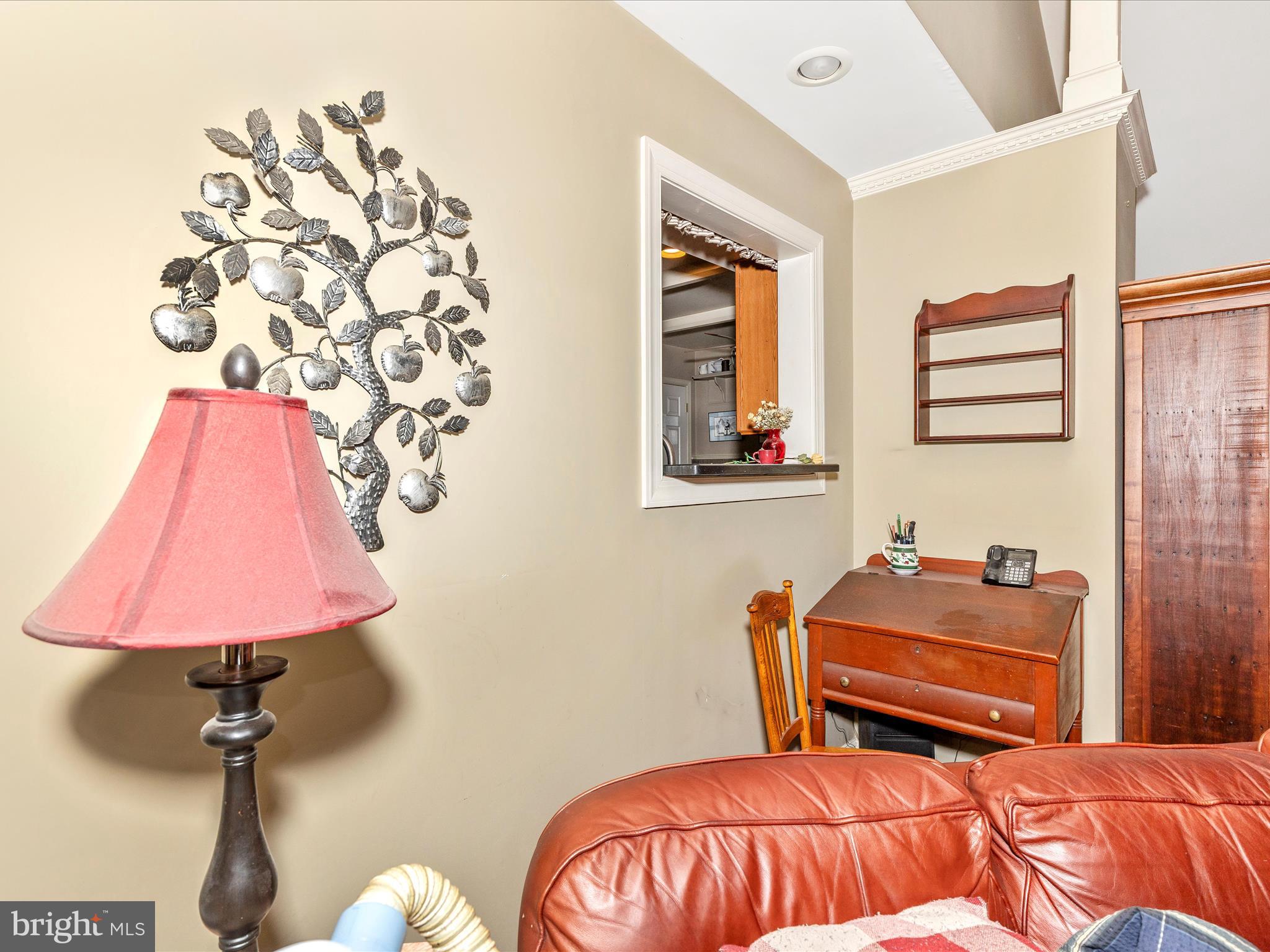 1111 Cummings Avenue Baltimore, MD 21228 - Photo 10 of 48 a bedroom with furniture and a lamp