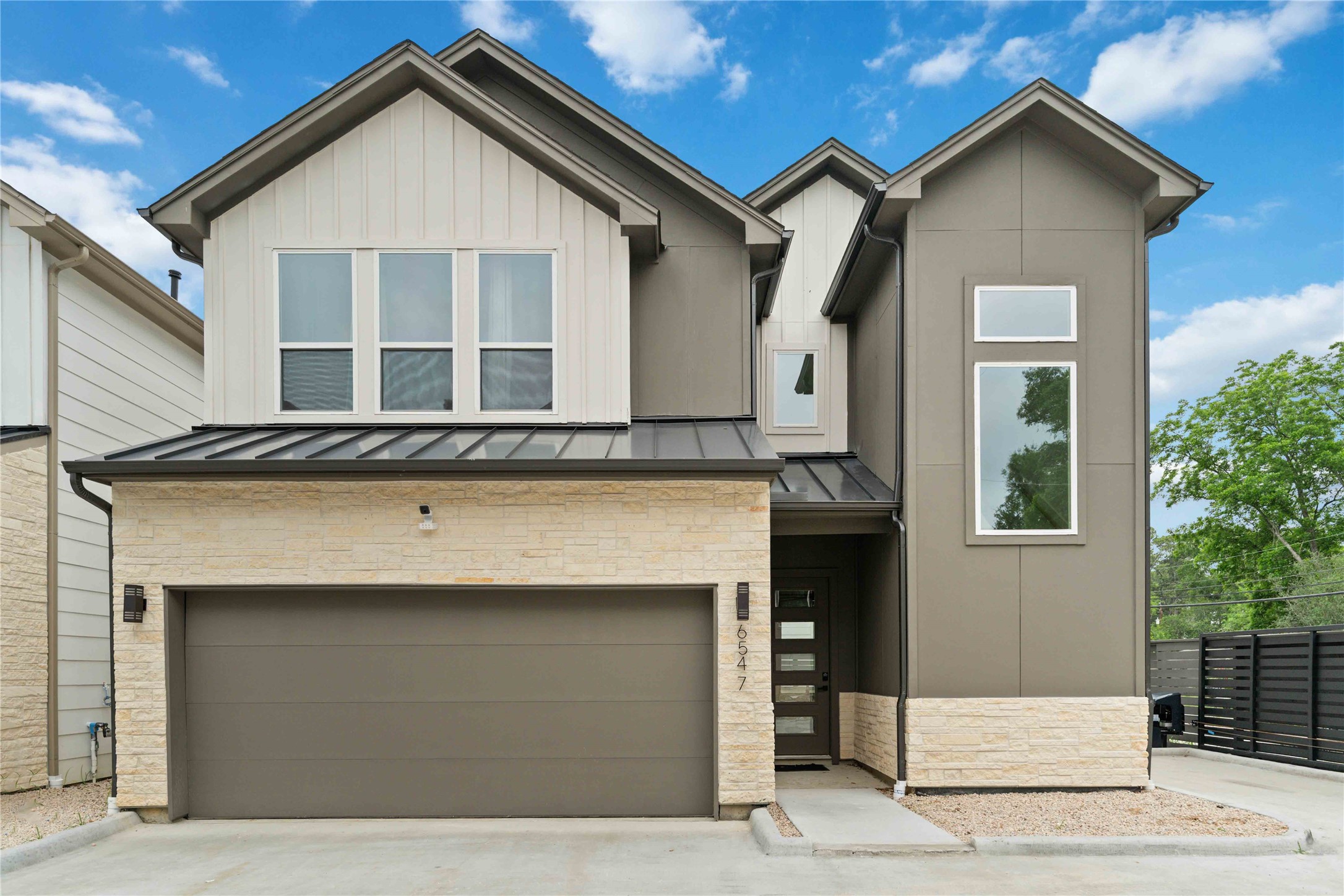 6539 Sealey Street Houston, TX 77091 - Photo 1 of 28 a front view of a house with a garage