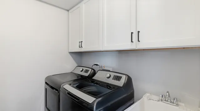 a stove top oven sitting inside of a kitchen