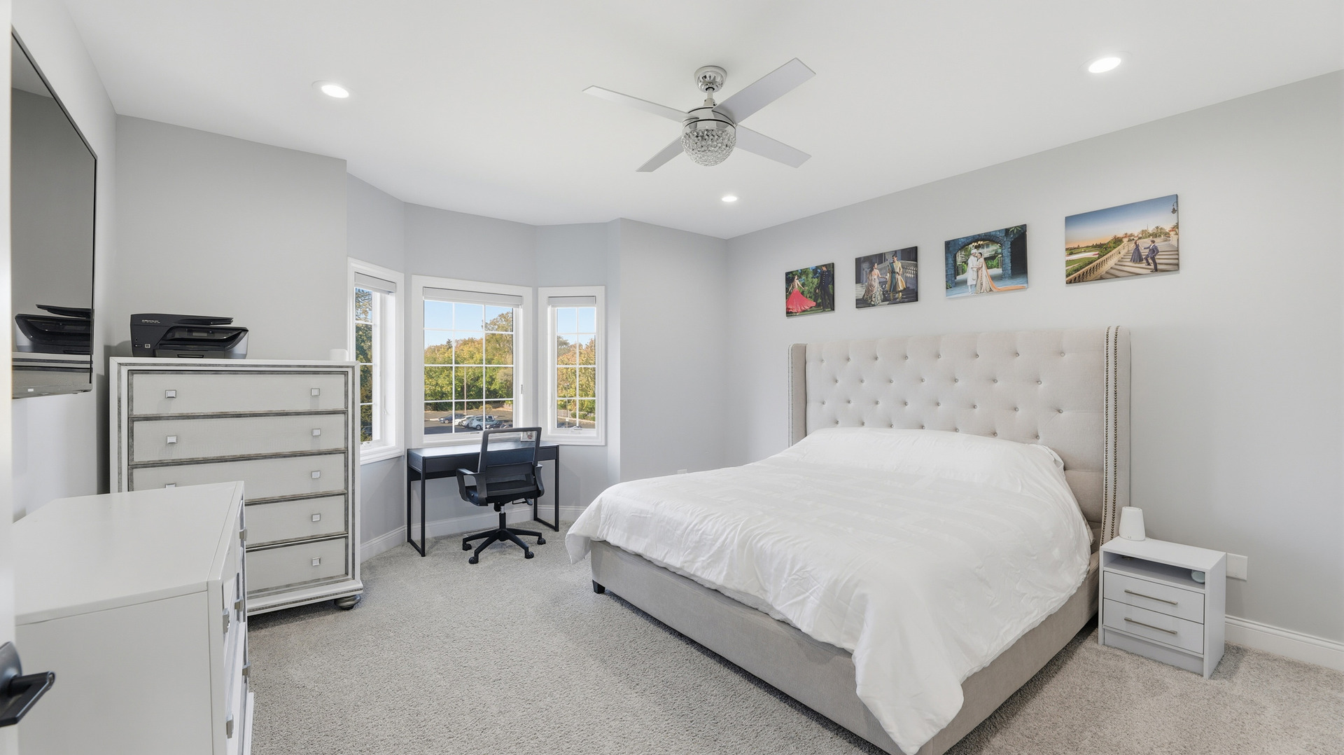 416 North Cass Avenue, Unit 6 Westmont, IL 60559 - Photo 12 of 24 a bedroom with a large bed a table and chair