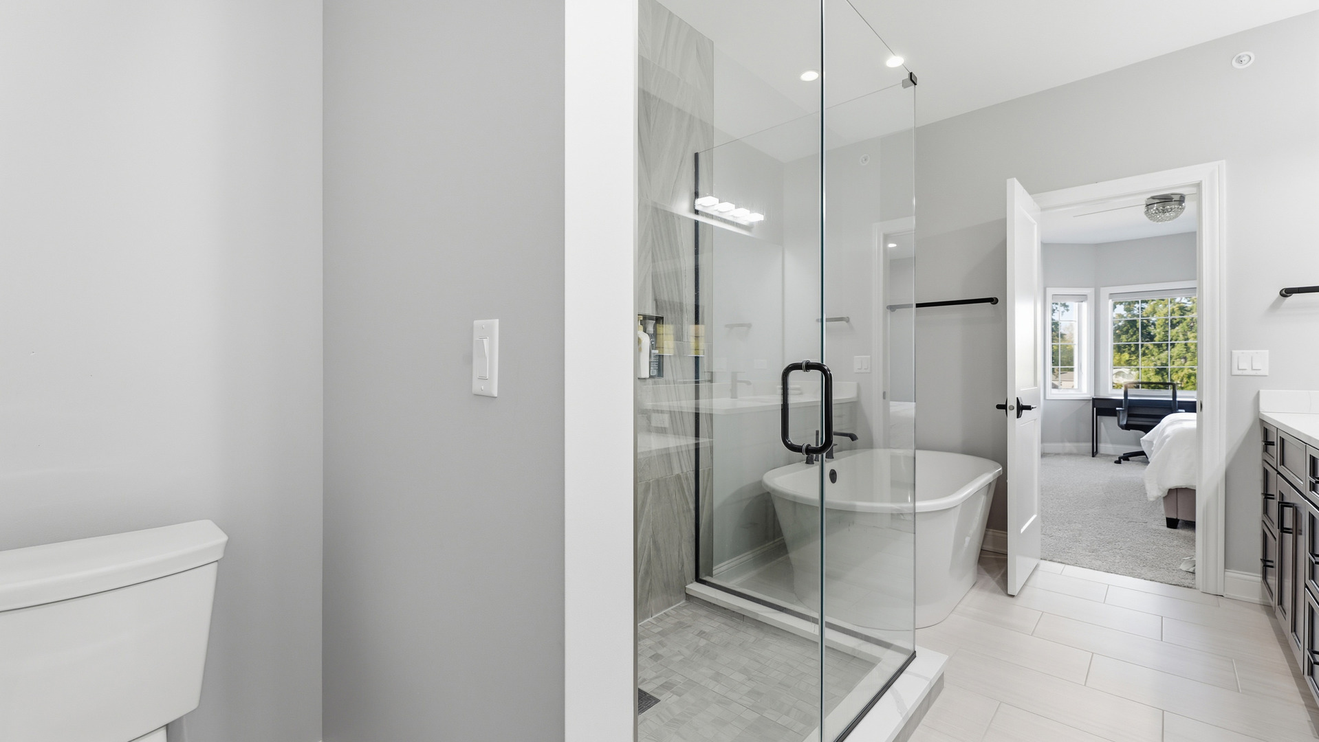 416 North Cass Avenue, Unit 6 Westmont, IL 60559 - Photo 14 of 24 a spacious bathroom with a toilet a sink and glass door