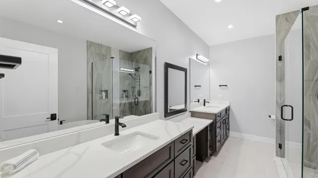 a bathroom with a tub sink and mirror