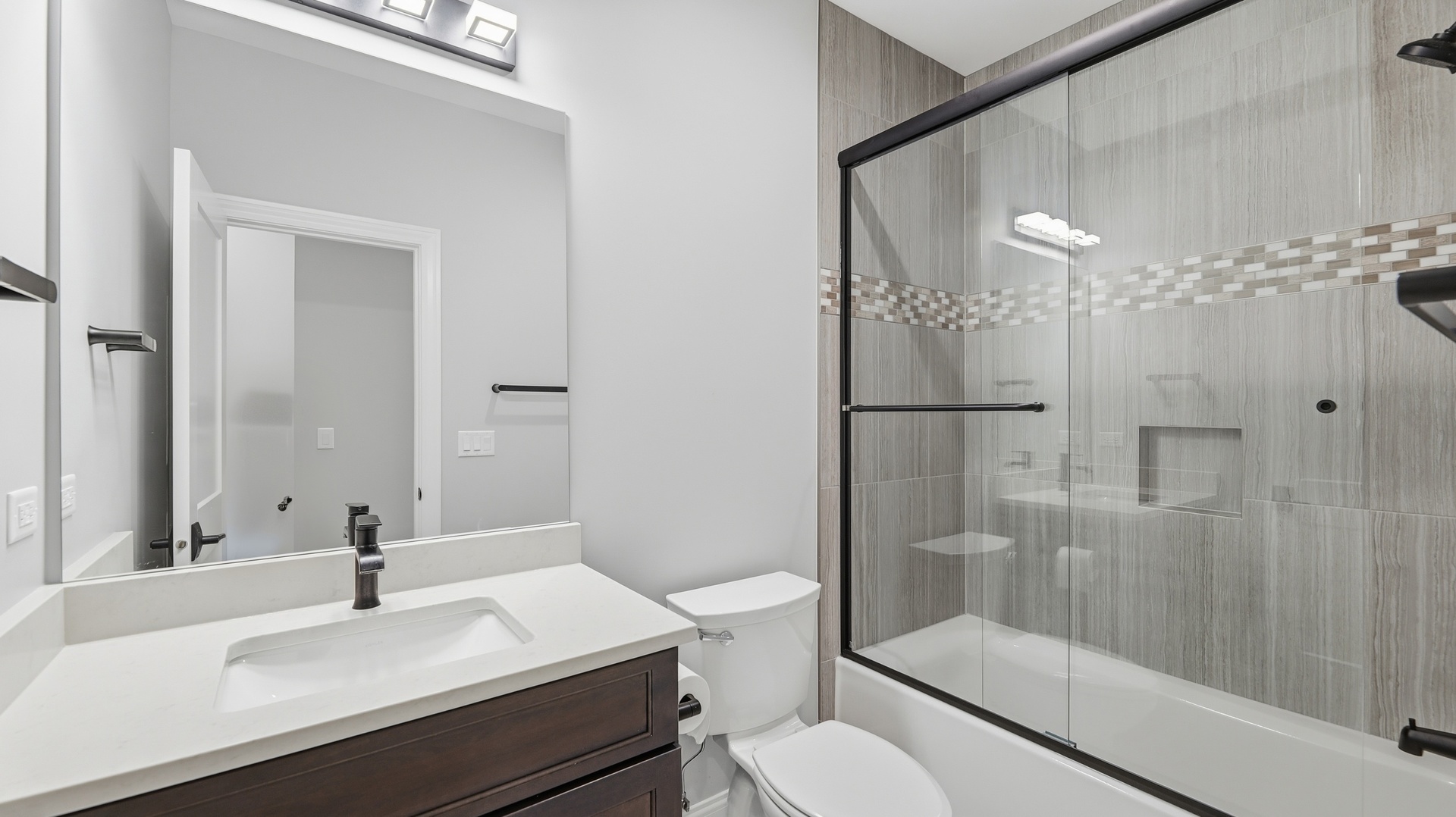 416 North Cass Avenue, Unit 6 Westmont, IL 60559 - Photo 19 of 24 a bathroom with a sink a toilet and shower