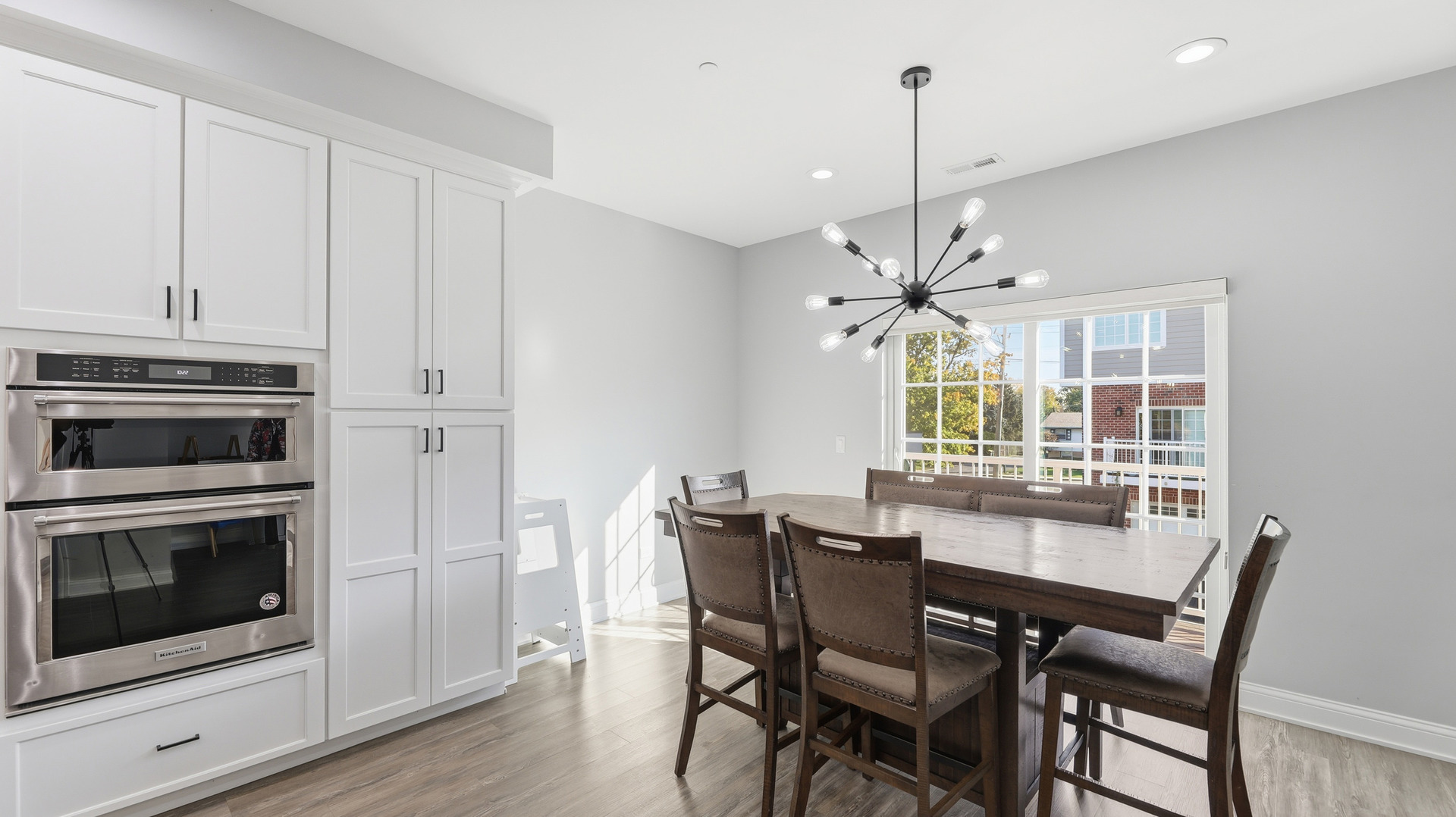 416 North Cass Avenue, Unit 6 Westmont, IL 60559 - Photo 5 of 24 a dining room with furniture a chandelier and wooden floor