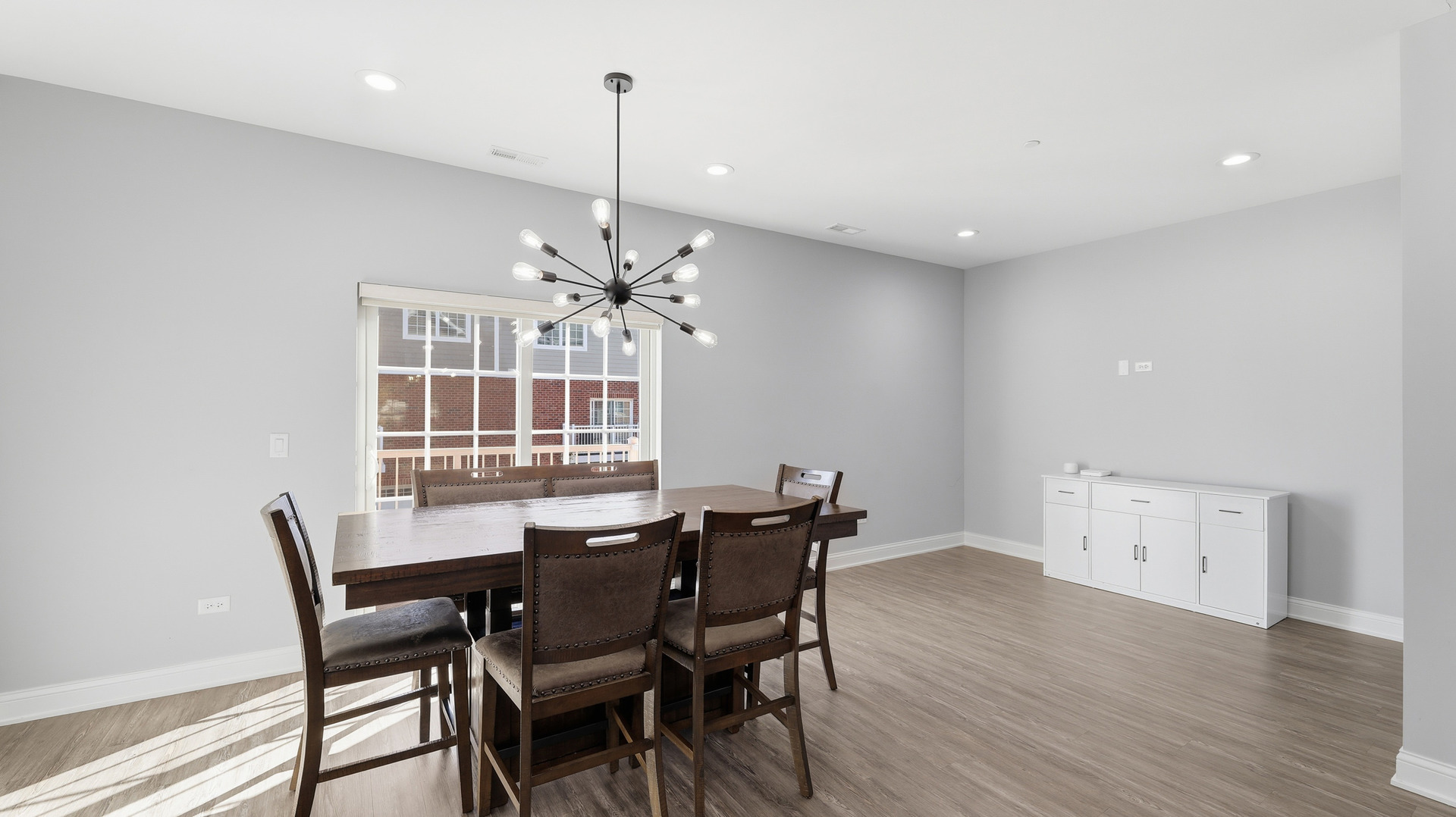 416 North Cass Avenue, Unit 6 Westmont, IL 60559 - Photo 7 of 24 a view of a dining room with furniture window and wooden floor