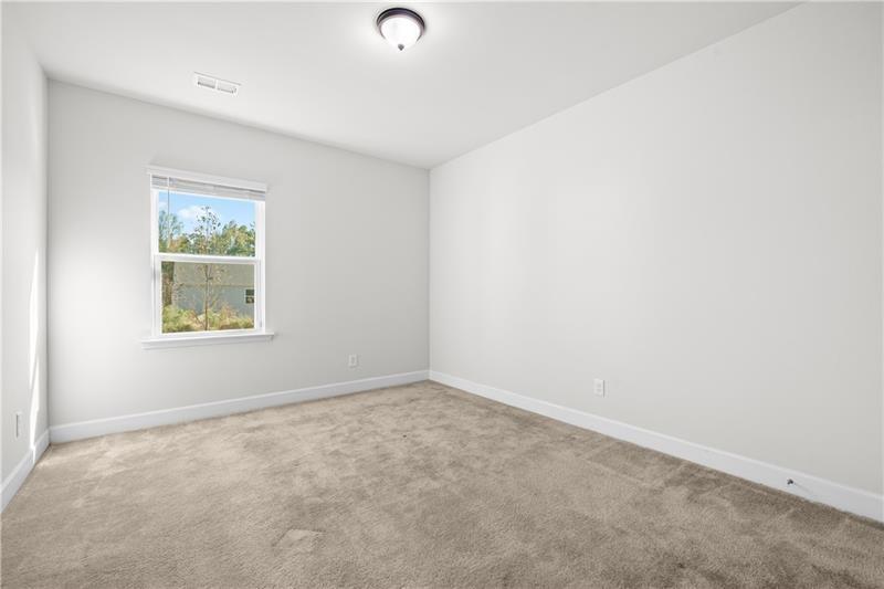5689 Wheeler Ridge Road Auburn, GA 30011 - Photo 18 of 40 an empty room with a window
