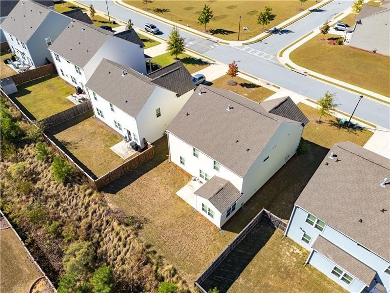 5689 Wheeler Ridge Road Auburn, GA 30011 - Photo 3 of 40 an aerial view of a house with a swimming pool