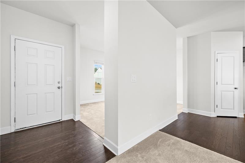5689 Wheeler Ridge Road Auburn, GA 30011 - Photo 6 of 40 an empty room with wooden floor & closet area