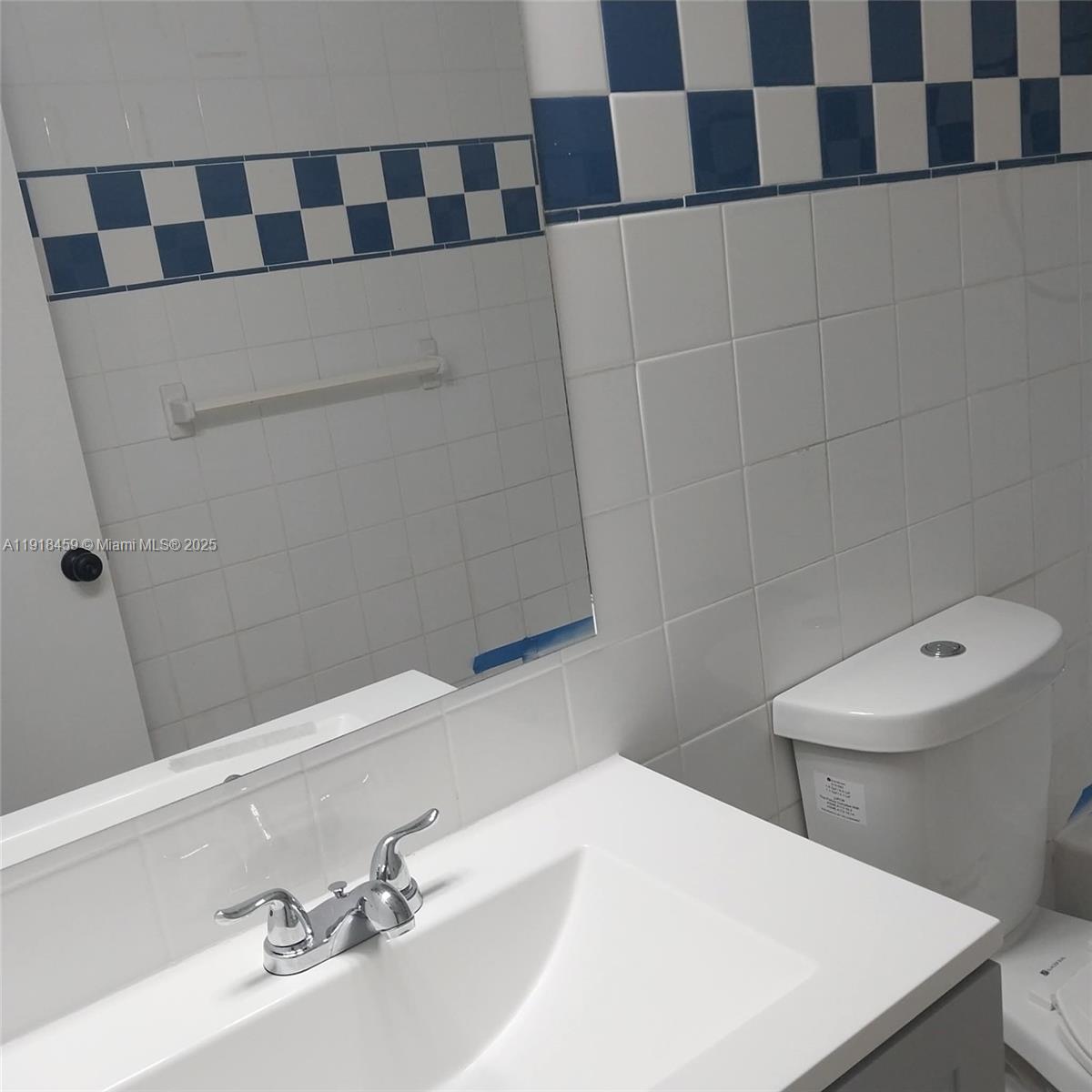 4111 Stirling Road, Unit 102 Fort Lauderdale, FL 33314 - Photo 11 of 13 a bathroom with a sink and a toilet