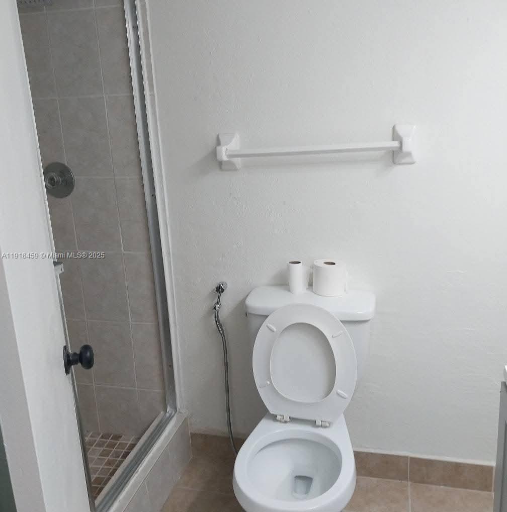 4111 Stirling Road, Unit 102 Fort Lauderdale, FL 33314 - Photo 13 of 13 a bathroom with a toilet and a sink