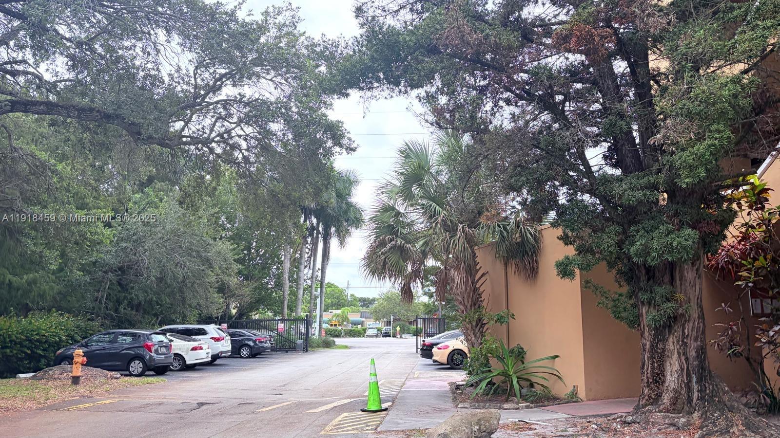 4111 Stirling Road, Unit 102 Fort Lauderdale, FL 33314 - Photo 2 of 13 a car parked on the side of a street