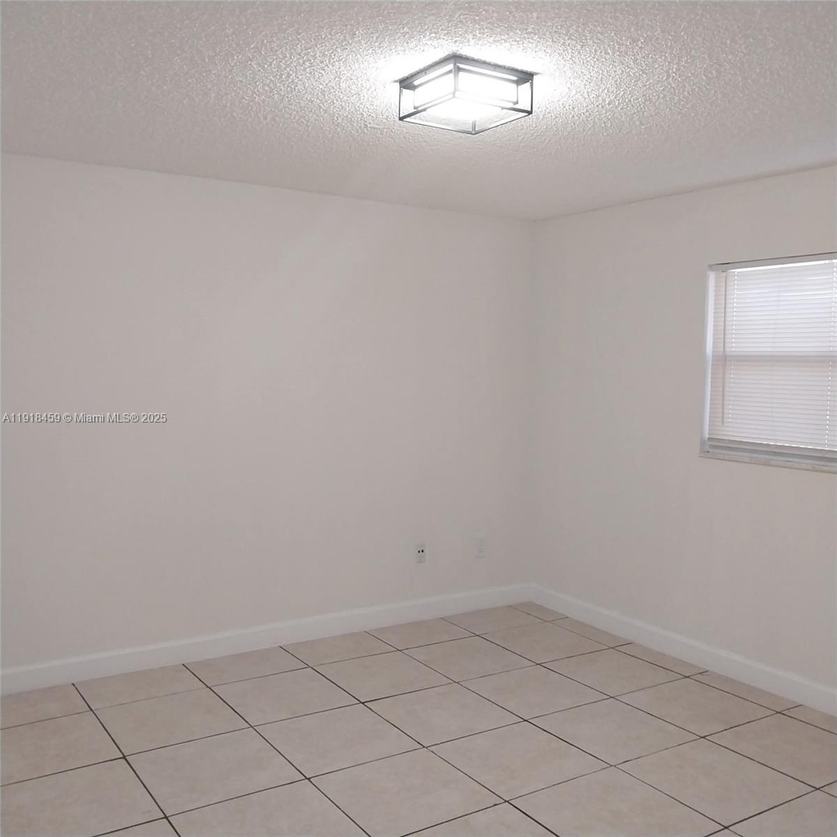 4111 Stirling Road, Unit 102 Fort Lauderdale, FL 33314 - Photo 8 of 13 a view of empty room