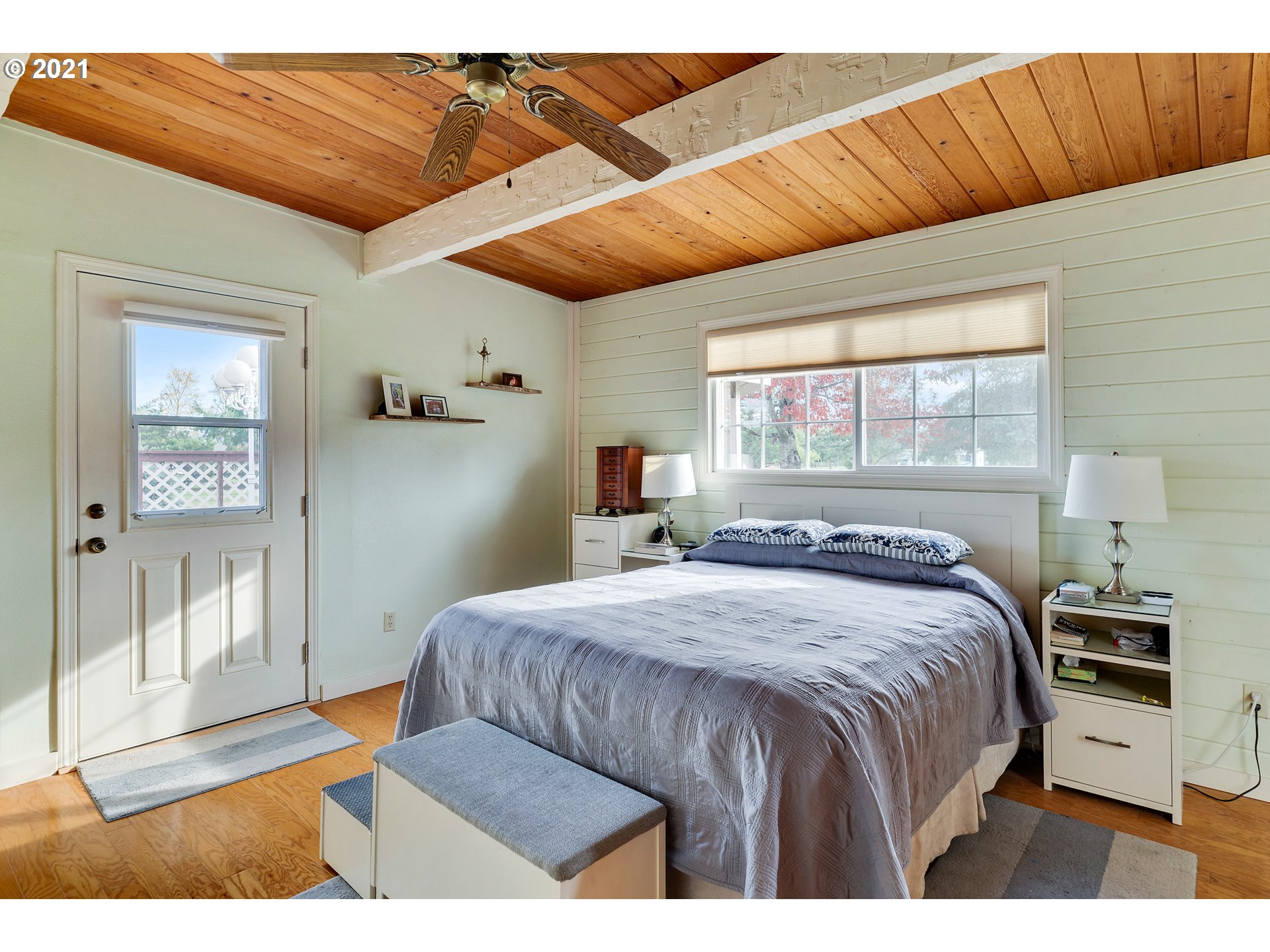 7320 South Mark Road Canby, OR 97013 - Photo 14 of 28 a bedroom with a large bed and a wooden floor