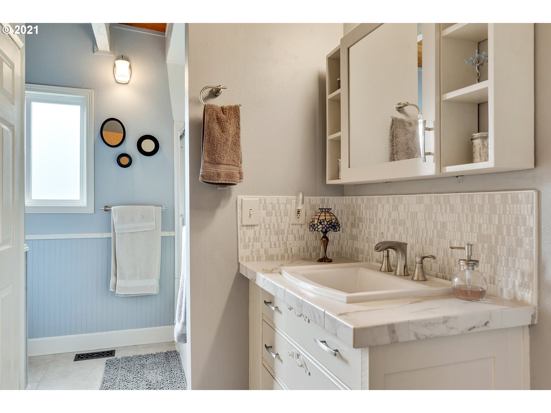 7320 South Mark Road Canby, OR 97013 - Photo 19 of 28 a bathroom with a sink and mirror