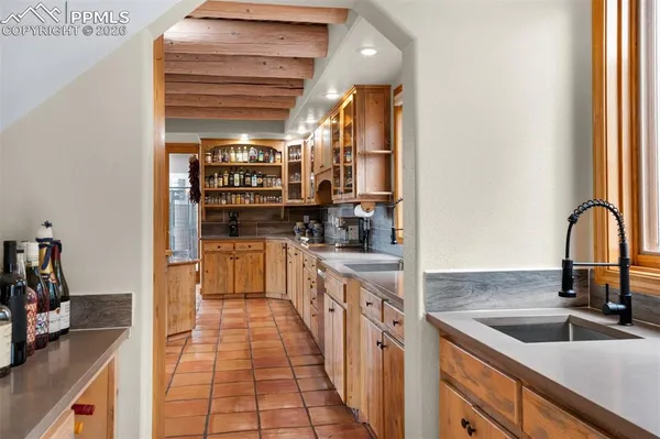 a kitchen with a sink and a refrigerator