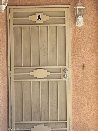 a close view of a utility room with dryer and washer