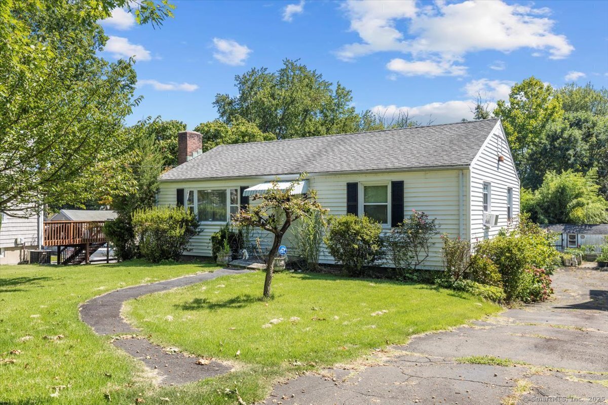 256 Belltown Road Stamford, CT 06905 - Photo 1 of 1 a front view of a house with garden