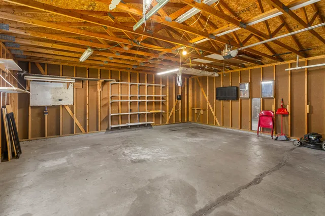 a view of empty room with wooden ceiling