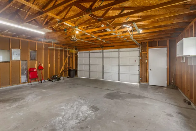 a view of a room with furniture and a garage