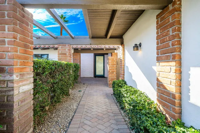 a view of a pathway along the building