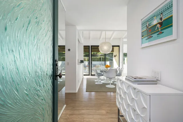a hallway with a view of living room