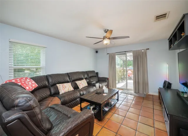 a living room with furniture and a window