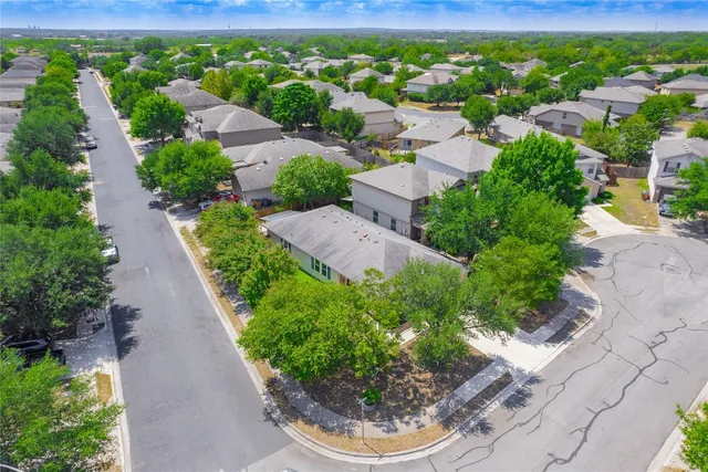 an aerial view of a house with garden