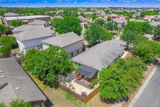 an aerial view of a house with a garden