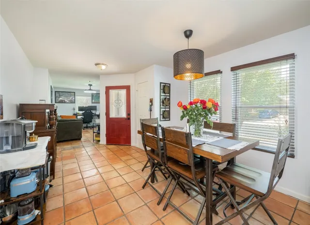 a view of a dining room with furniture window and outside view