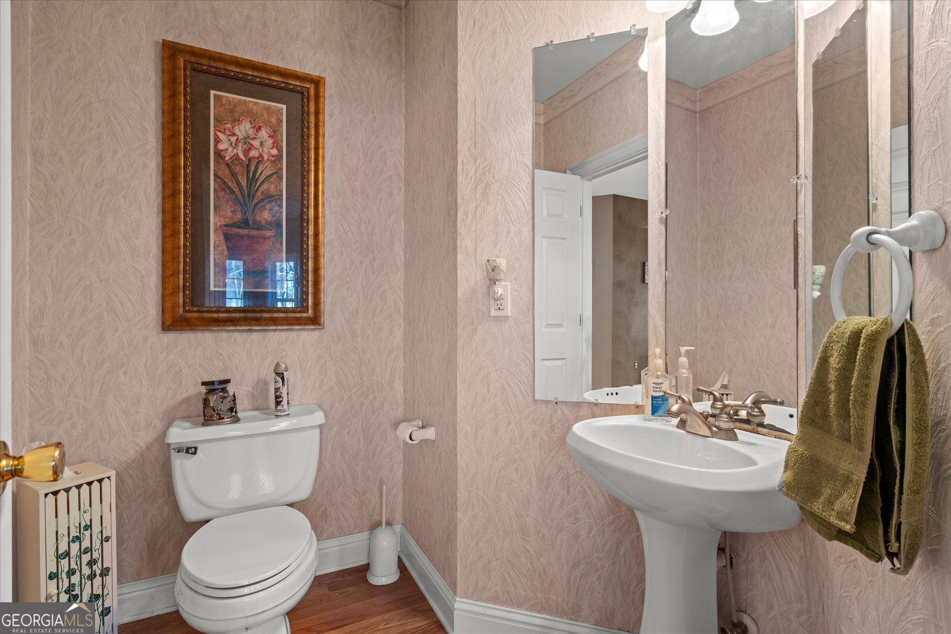 4051 Golfview Court Villa Rica, GA 30180 - Photo 11 of 77 a bathroom with a toilet sink and mirror