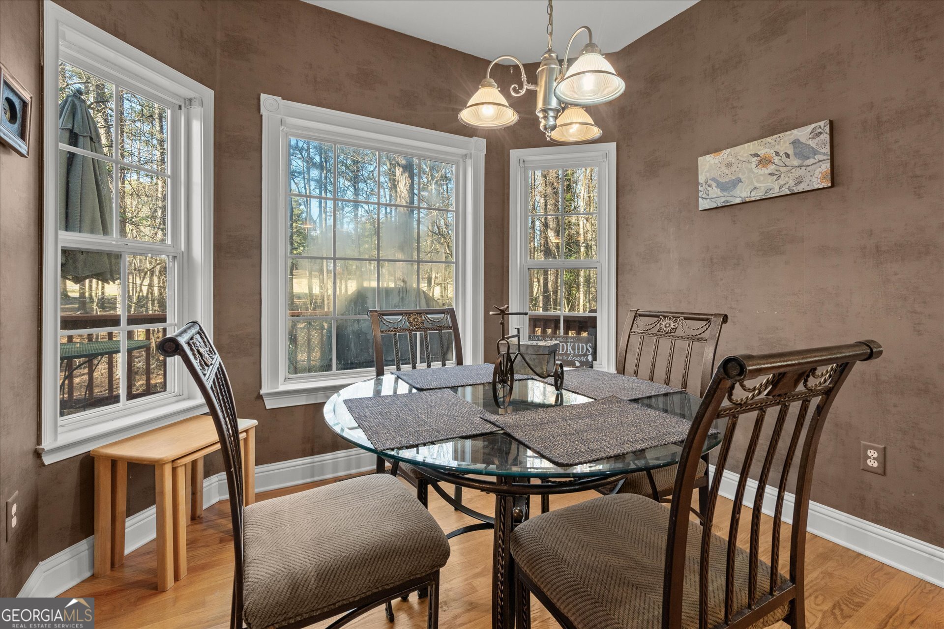 4051 Golfview Court Villa Rica, GA 30180 - Photo 13 of 77 a view of a dining room with furniture large windows and wooden floor