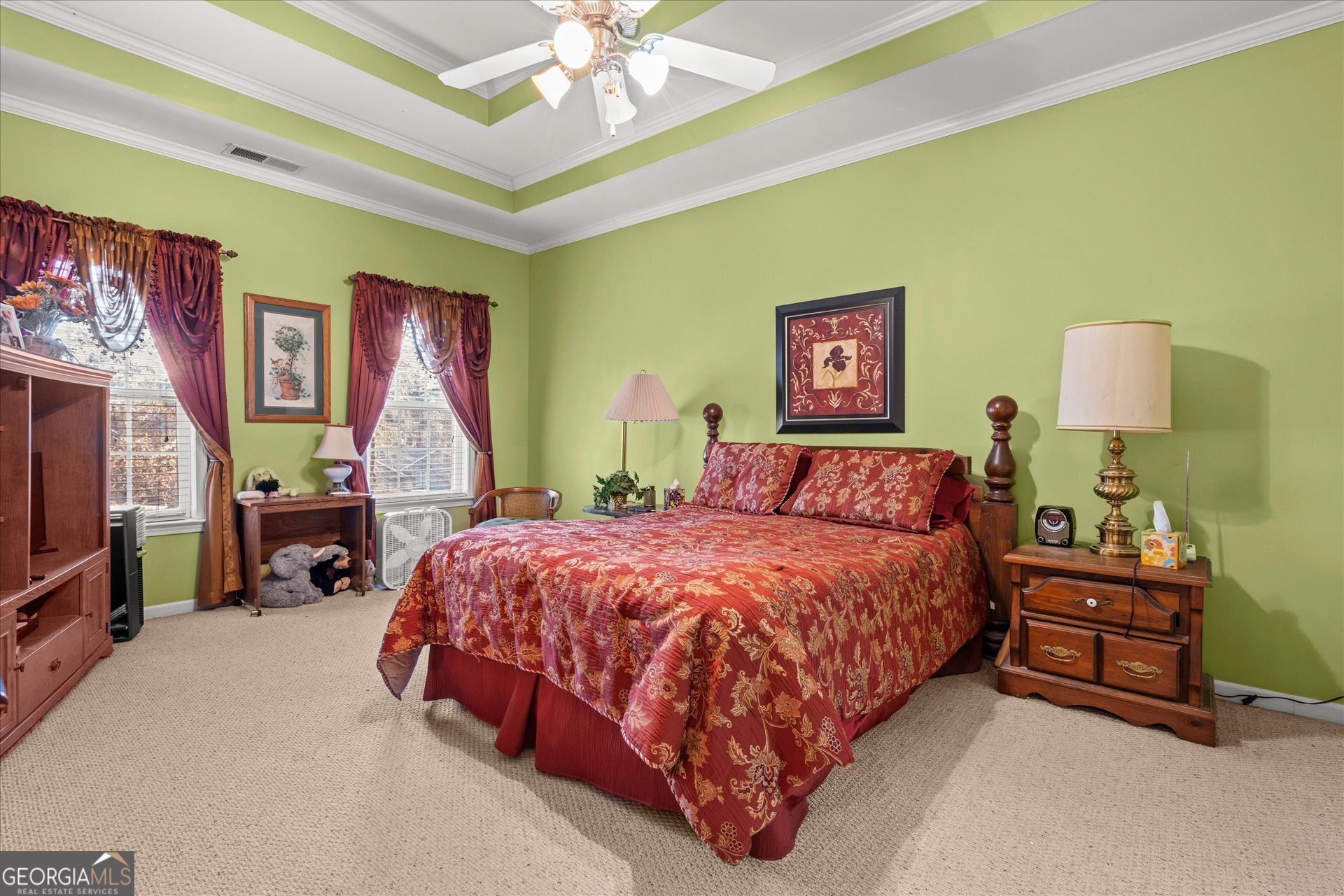 4051 Golfview Court Villa Rica, GA 30180 - Photo 23 of 77 a spacious bedroom with a bed and a chandelier
